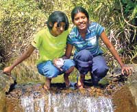 Kavindi Jayawardene, at left, with a friend. Ã¢â‚¬Å“She was a very loving child, a hard-working student, and a devout Buddhist.Ã¢â‚¬Â 
